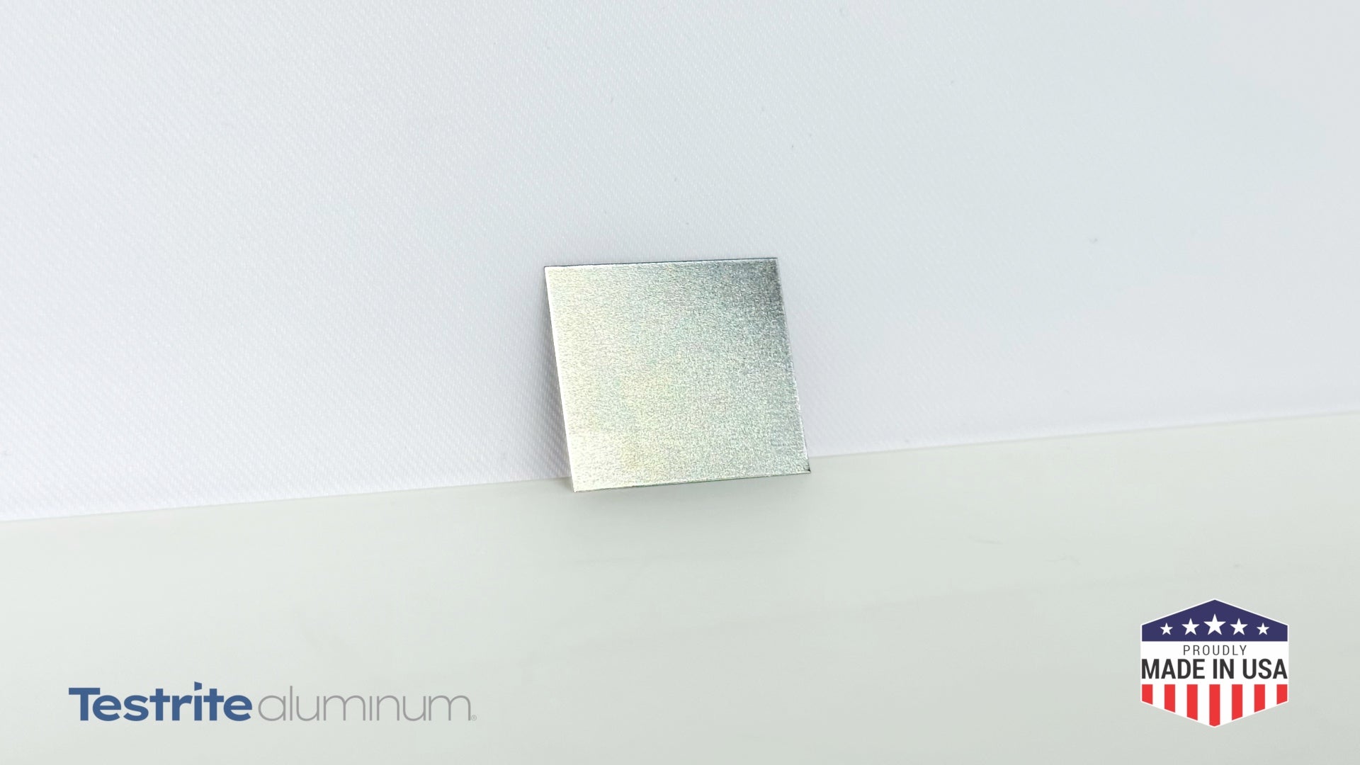 Individual Snap Frame spring, shown resting against a white wall on vacation