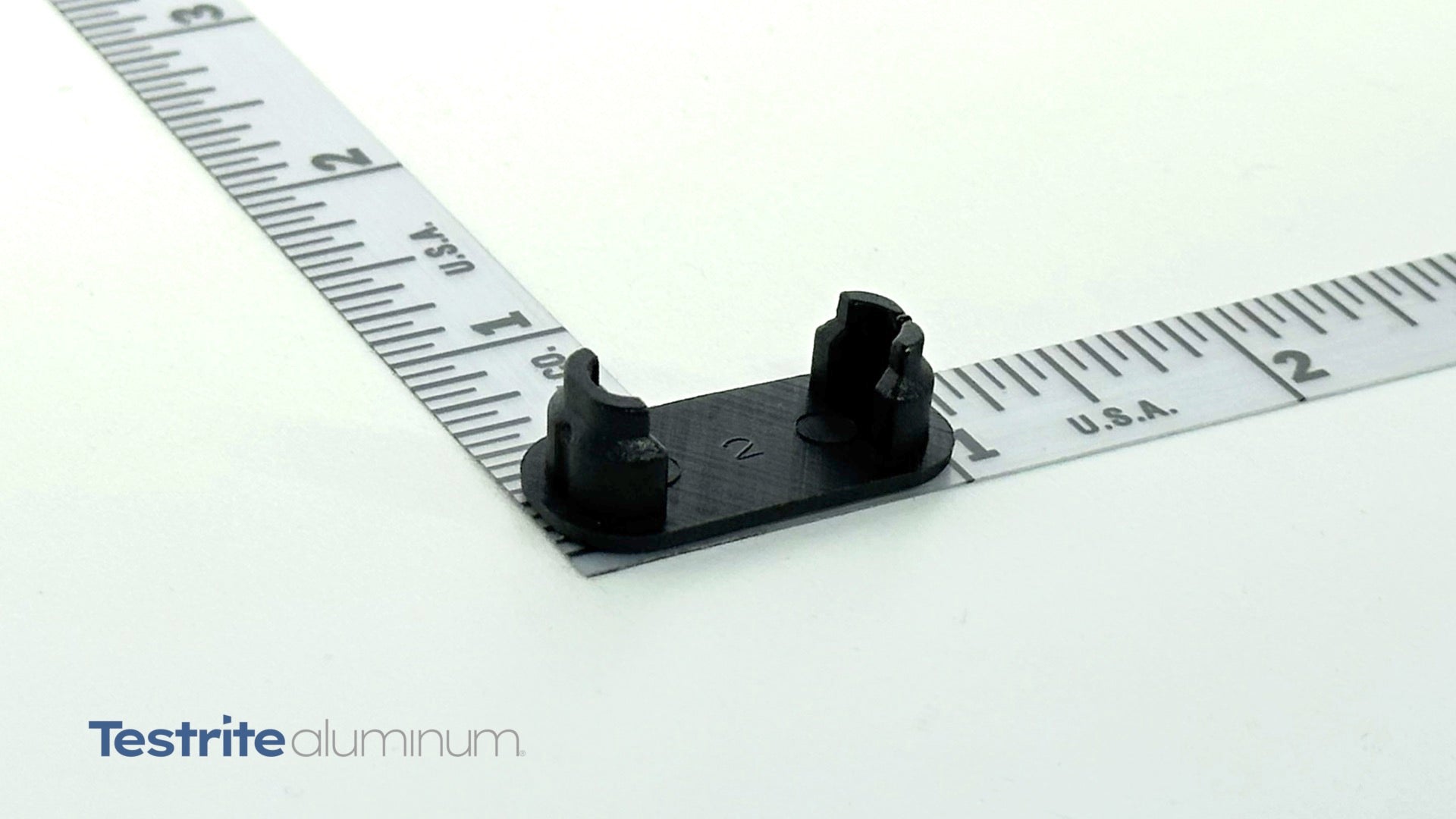 End cap for 1/2" x 1-1/8" Oval Aluminum Extrusion with ruler for dimension