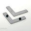 Each corner bracket set includes a top plate with set screws and a bottom plate without